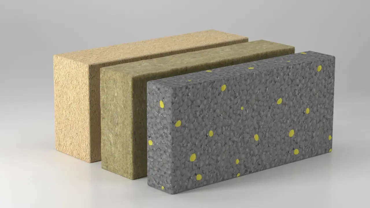 Drei Schichten Dämmmaterial: Holzfaser, Steinwolle und ein diffusionsoffenes EPS-Material mit gelben Granulaten.