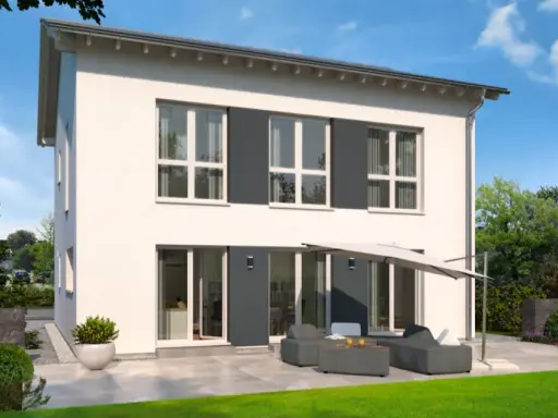 Moderne Stadtvilla mit Satteldach, großen Fenstern und einer gemütlichen Terrasse mit Lounge-Möbeln.